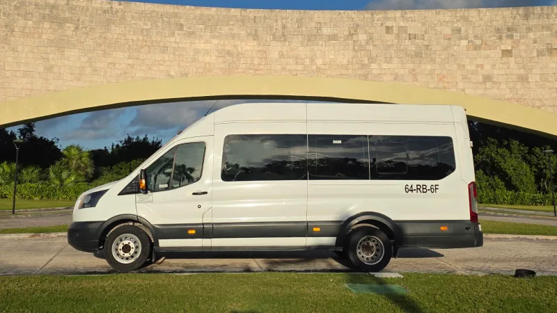 White Ford Transit private transfer vehicle